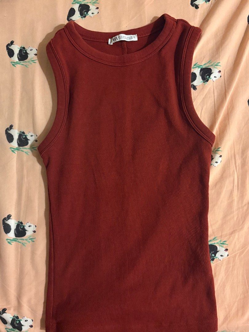 Zara Ribbed Tank Top in Wine Red (Category: Sleeveless) located in Manila. Submitted by mingabz (Listing ID 1453365641, Image 1). Description: - Zara ribbed tank top - Lovely rust color - Sleeveless design - Comfortable fit - Great for layering or wearing on its own - Versatile piece for any wardrobe - Easy to pair with jeans or skirts.