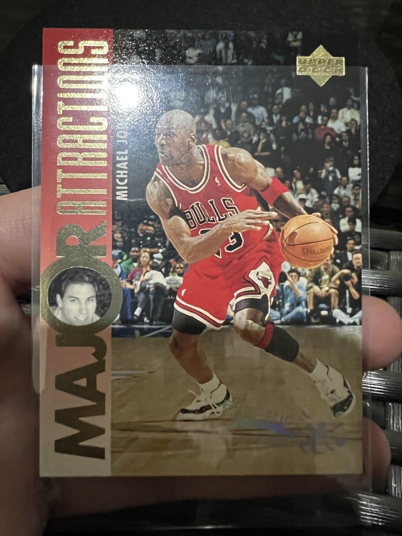 1993 Upper Deck Michael Jordan Electric Court Card (Category: Raw Singles) located in Quezon City. Submitted by maropa (Listing ID 1456770835, Image 2). Description: Selling a 1993 Upper Deck Michael Jordan Electric Court card. Features the 'Major Attractions' insert. This card highlights Jordan in his Bulls uniform. The back of the card includes information about David Hanson and his top players. A great addition for any basketball card collecto