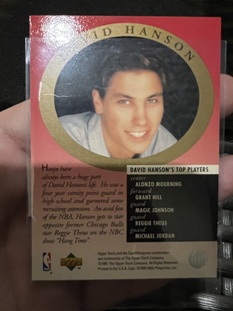 1993 Upper Deck Michael Jordan Electric Court Card (Category: Raw Singles) located in Quezon City. Submitted by maropa (Listing ID 1456770835, Image 3). Description: Selling a 1993 Upper Deck Michael Jordan Electric Court card. Features the 'Major Attractions' insert. This card highlights Jordan in his Bulls uniform. The back of the card includes information about David Hanson and his top players. A great addition for any basketball card collecto