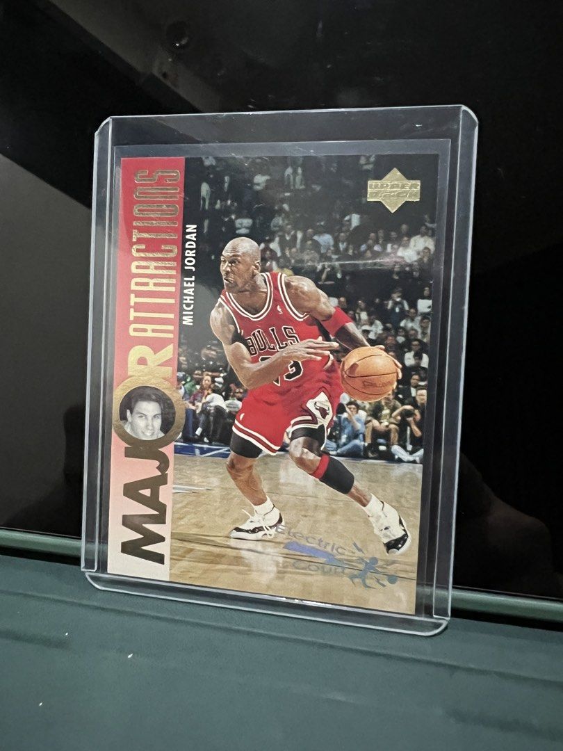 1993 Upper Deck Michael Jordan Electric Court Card (Category: Raw Singles) located in Quezon City. Submitted by maropa (Listing ID 1456770835, Image 1). Description: Selling a 1993 Upper Deck Michael Jordan Electric Court card. Features the 'Major Attractions' insert. This card highlights Jordan in his Bulls uniform. The back of the card includes information about David Hanson and his top players. A great addition for any basketball card collecto