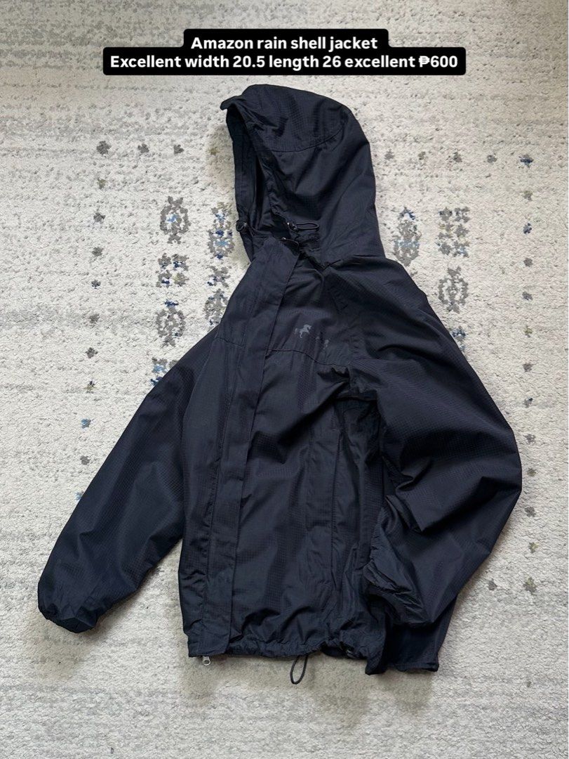 Amazon Rain Shell chrome Jacket (Category: Coats, Jackets and Outerwear) located in Daet. Submitted by thrifthings2018 (Listing ID 1456618870, Image 1). Description: - Black Amazon rain shell jacket - Hooded with drawstring hem - Unique horse graphic on the back - Lightweight and practical for rainy weather - Measurements: Width 20.5 inches, Length 26 inches.