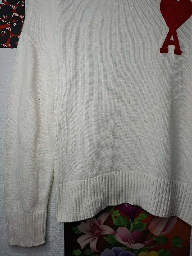 AMI PARIS KNITTED HEART LOGO (Category: Luxury Apparel) located in Manila. Submitted by yaseen_73 (Listing ID 1456722250, Image 3). Description: Off-white wool Ami de Coeur crewneck sweater from Ami Paris features the brand's signature red intarsia-knitted heart logo on the chest Made in Tunisia Wearing Size : M on Tag Dimensions : W24½ x L26½ Color Rate : 10/10 📌Needs Re - Wash No Minor/Major Issue Nearly New Condition P.S. - This Item is Off /