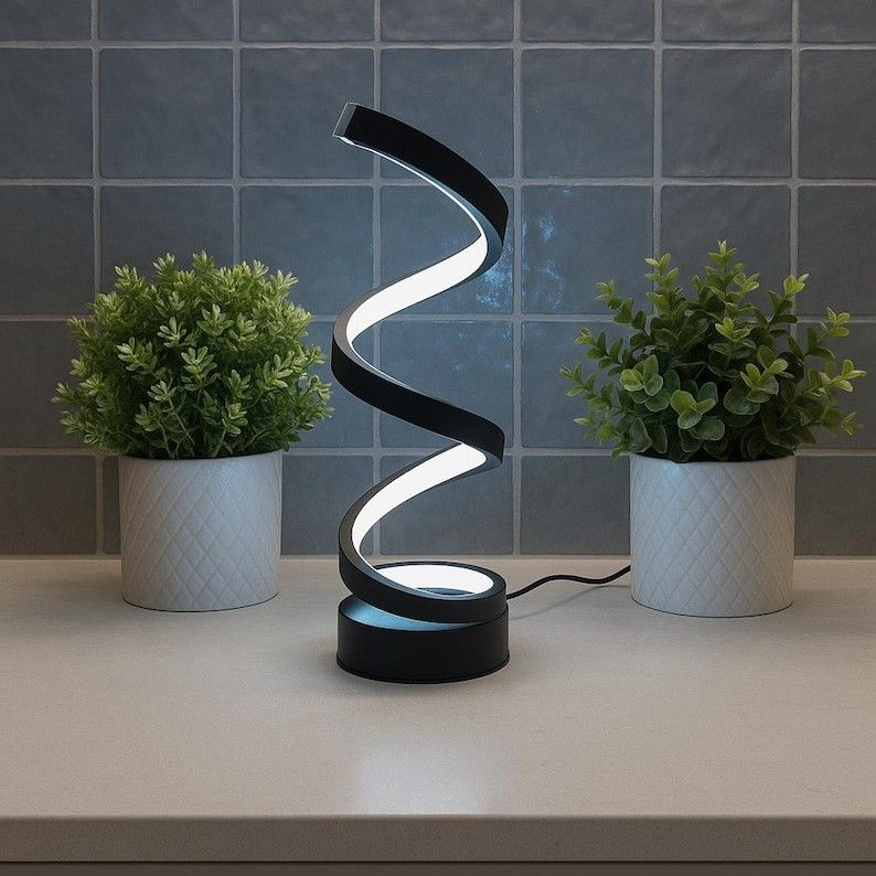 Art and Sculpture Mood Lamp (Category: Lighting) located in Quezon City. Submitted by vuzelavintage (Listing ID 1456742557, Image 2). Description: Must have No haggling pls 🎦 Product video upon request New with box Led light 3 light modes & dimmable brightness control For pick up/Lalamove Featuring a sleek, contemporary design, this minimalist lamp emits a soft, ambient glow that creates a cozy and inviting atmosphere. Actual photos posted Retai