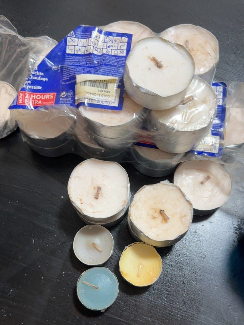 Assorted Candles - (Category: Home Fragrance) located in Singapore. Submitted by sellclothesg (Listing ID 1456719084, Image 1). Description: Mix of new and used - Pack of Duni tealight candles - 2-hour burn time per candle - Assorted colors: white, yellow, and blue - Ideal for creating a cozy ambiance - Plenty of candles included.