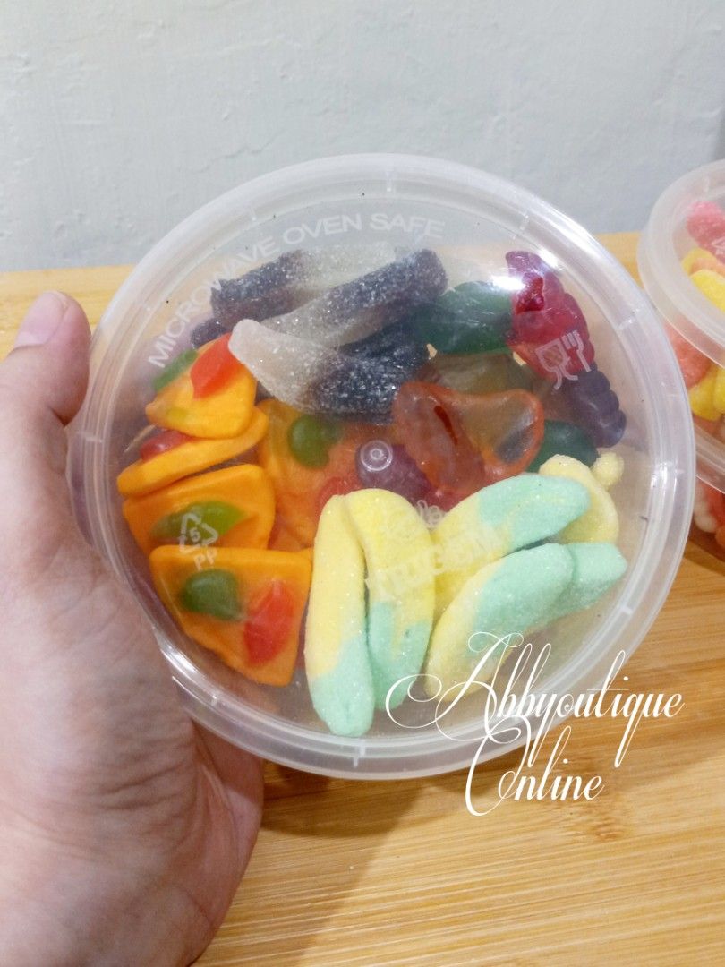 Assorted Gummy Candies Mix - Fun Shapes & Flavors (Category: Other Food & Drinks) located in Dasmarinas. Submitted by abbyoutique_online (Listing ID 1456682536, Image 2). Description: • Fun mix of gummy candies • Variety of shapes (fruits, teeth, etc.) • Perfect for snacking or party favors • Different flavors and colors in each container • Enjoyable for kids and adults alike • Grab a tub for a sweet treat! • Each tub has 4 different varieties • 