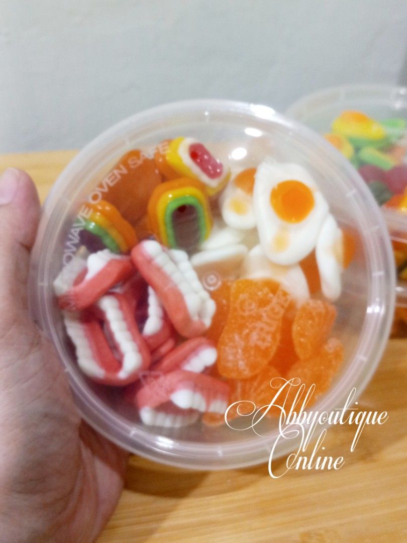 Assorted Gummy Candies Mix - Fun Shapes & Flavors (Category: Other Food & Drinks) located in Dasmarinas. Submitted by abbyoutique_online (Listing ID 1456682536, Image 3). Description: • Fun mix of gummy candies • Variety of shapes (fruits, teeth, etc.) • Perfect for snacking or party favors • Different flavors and colors in each container • Enjoyable for kids and adults alike • Grab a tub for a sweet treat! • Each tub has 4 different varieties • 