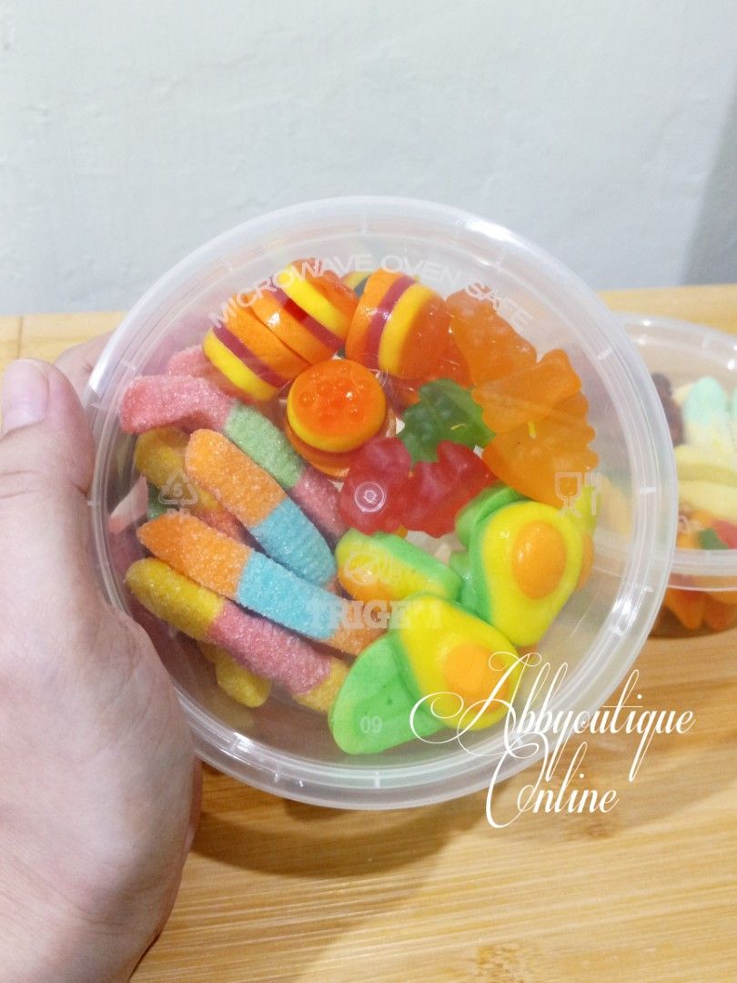 Assorted Gummy Candies Mix - Fun Shapes & Flavors (Category: Other Food & Drinks) located in Dasmarinas. Submitted by abbyoutique_online (Listing ID 1456682536, Image 1). Description: • Fun mix of gummy candies • Variety of shapes (fruits, teeth, etc.) • Perfect for snacking or party favors • Different flavors and colors in each container • Enjoyable for kids and adults alike • Grab a tub for a sweet treat! • Each tub has 4 different varieties • 