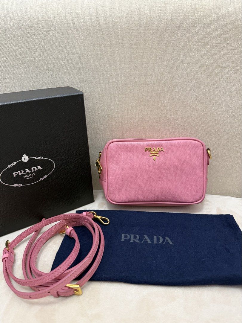 Authentic Prada Saffiano Mini Camera Bag (Category: Luxury Bags & Wallets) located in Manila. Submitted by maria_2326 (Listing ID 1450039991, Image 1). Description: Prada Saffiano Mini Camera Bag Baby Pink color Guarantee Authentic Promax CANNOT fit Inclusions: Provided box& dust bag Original Sling Location: Manila/QC .