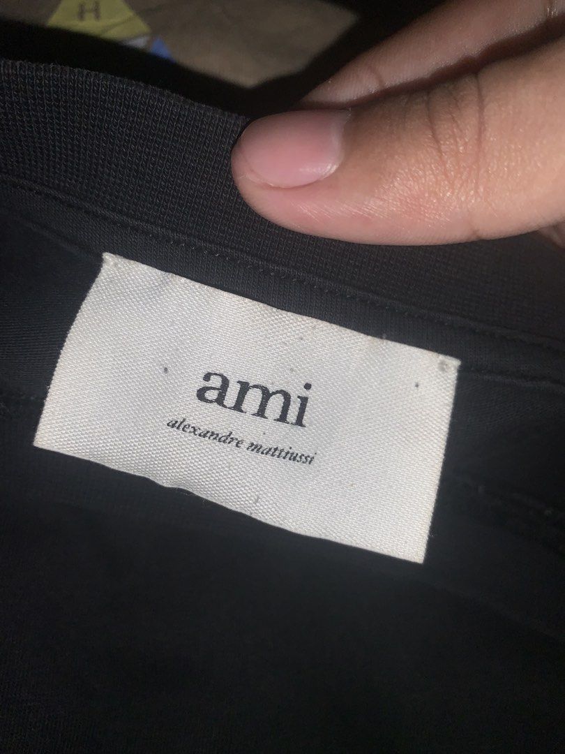 Black Ami (Category: Tshirts & Polo Shirts ) located in Davao. Submitted by 2_thrift (Listing ID 1456719618, Image 2). Description: 22x29 Authentic/Legit Xxl on tag 8.7 color rate good condi 4 pinhole at last pic Nego.