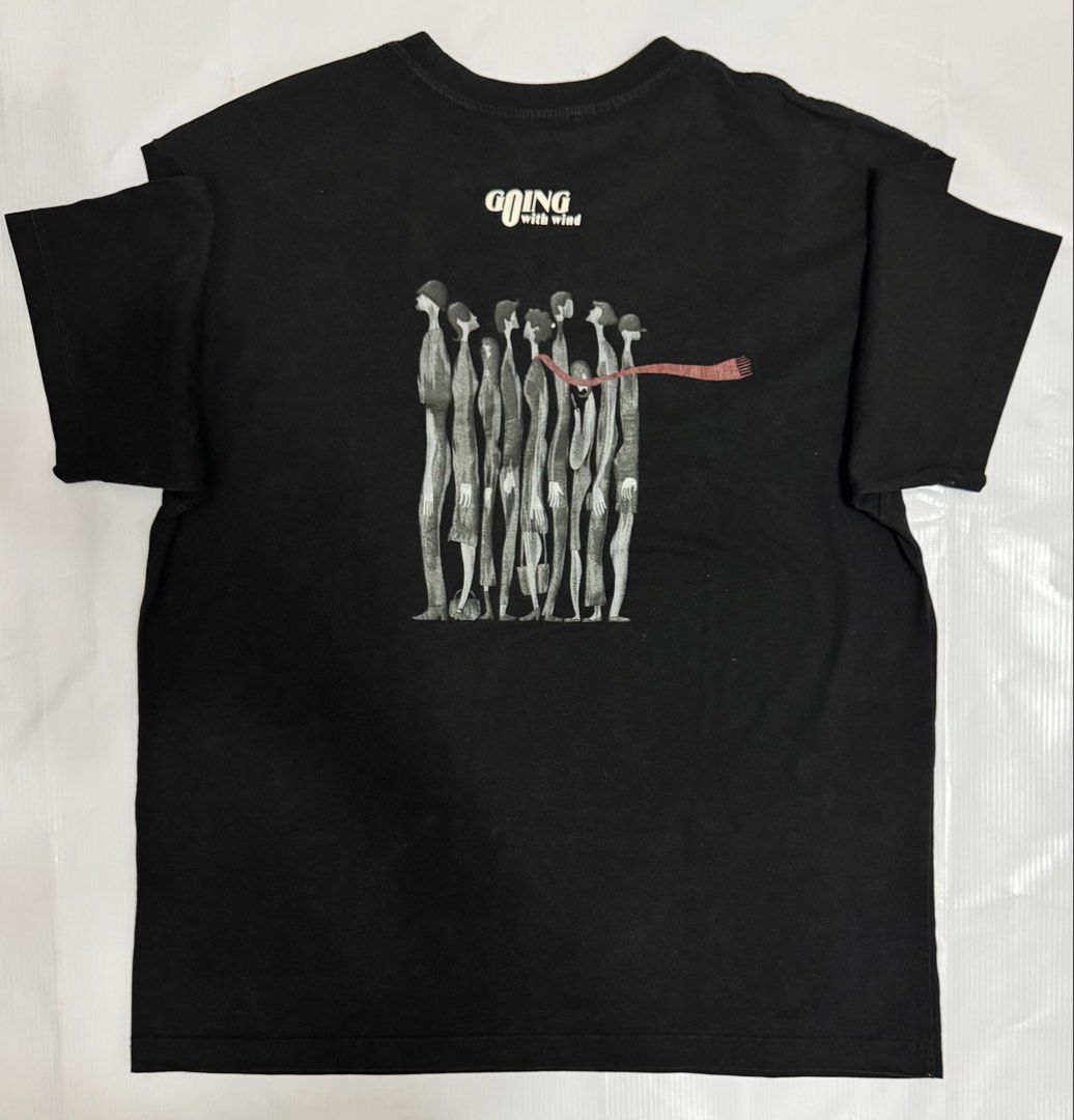 Black Graphic T-Shirt "Going With Wind" (Category: Tshirts & Polo Shirts ) located in Quezon City. Submitted by domsselections2 (Listing ID 1456765527, Image 2). Description: - Classic black t-shirt - Small graphic logo on the front - "Going With Wind" graphic print on the back - Comfortable and casual design - Ideal for everyday wear Dimes: 22x27”.