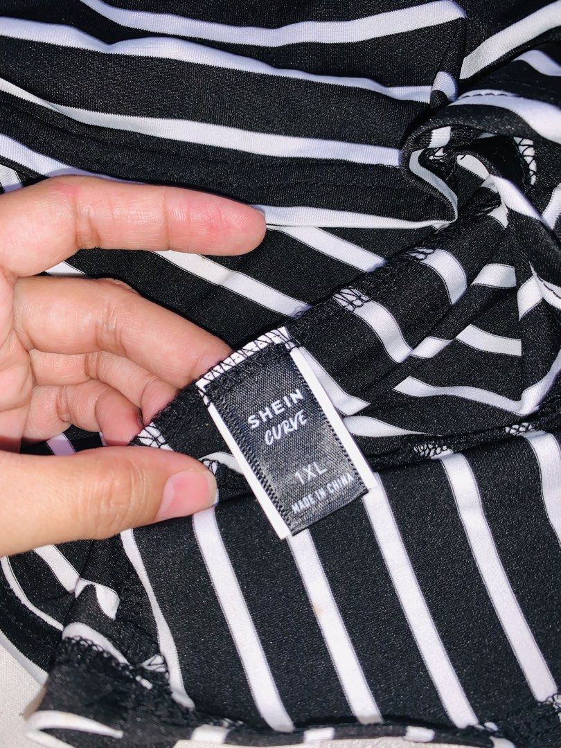 Black-and-white horizontal striped short-sleeve top (Category: Blouses) located in Pasig City. Submitted by nyca1989 (Listing ID 1456613592, Image 3). Description: Black-and-white horizontal striped short-sleeve top features an asymmetrical diagonal neckline with a unique cutout strap detail with tie design. Fits to XL - XXL Feel free to negotiate! Open to reasonable haggling. Let’s meet halfway and make a fair deal. Serious buyers are very welco