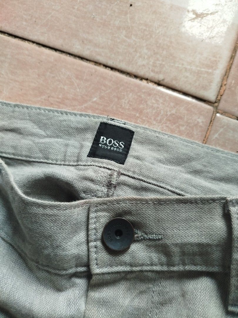 BOSS Hugo Boss Grey Herringbone Trousers (Category: Trousers) located in Abucay. Submitted by ukay_withdj (Listing ID 1456687894, Image 2). Description: - Grey BOSS Hugo Boss trousers - Classic fit - Herringbone pattern fabric - Two back pockets - Leather patch on back waistband - Ideal for casual or smart casual outfits - Please check photos for condition details.
