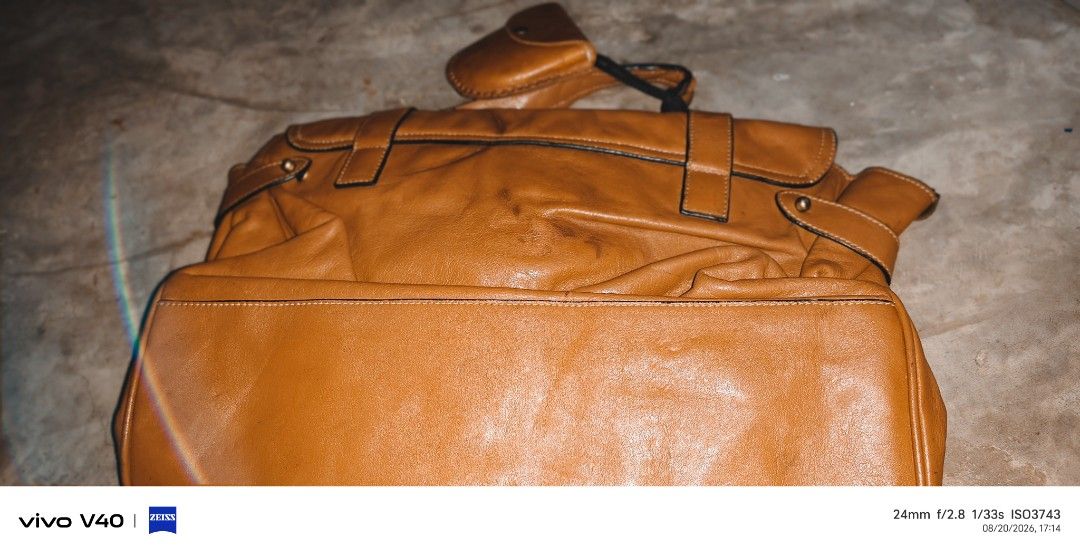 Brown Leather Satchel Bag with Buckle Closure (Category: Luxury Bags & Wallets) located in Buenavista. Submitted by silverwhale.c402fa (Listing ID 1456685766, Image 2). Description: - Genuine brown leather satchel bag - Main compartment with interior zip pocket - Secure buckle closures on front flap - Durable top handle - Detachable and adjustable shoulder strap - Leather shows natural marks and scuffs, adding character - Interior lining features