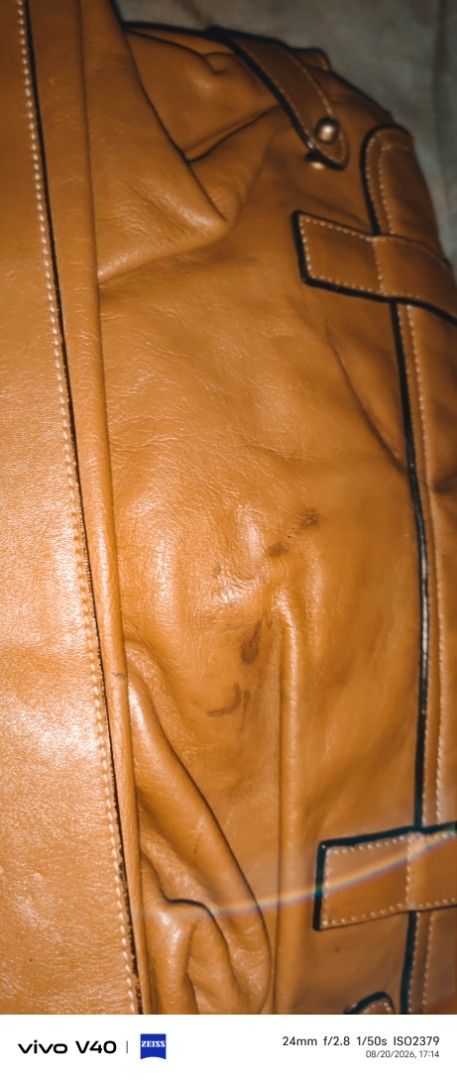 Brown Leather Satchel Bag with Buckle Closure (Category: Luxury Bags & Wallets) located in Buenavista. Submitted by silverwhale.c402fa (Listing ID 1456685766, Image 3). Description: - Genuine brown leather satchel bag - Main compartment with interior zip pocket - Secure buckle closures on front flap - Durable top handle - Detachable and adjustable shoulder strap - Leather shows natural marks and scuffs, adding character - Interior lining features