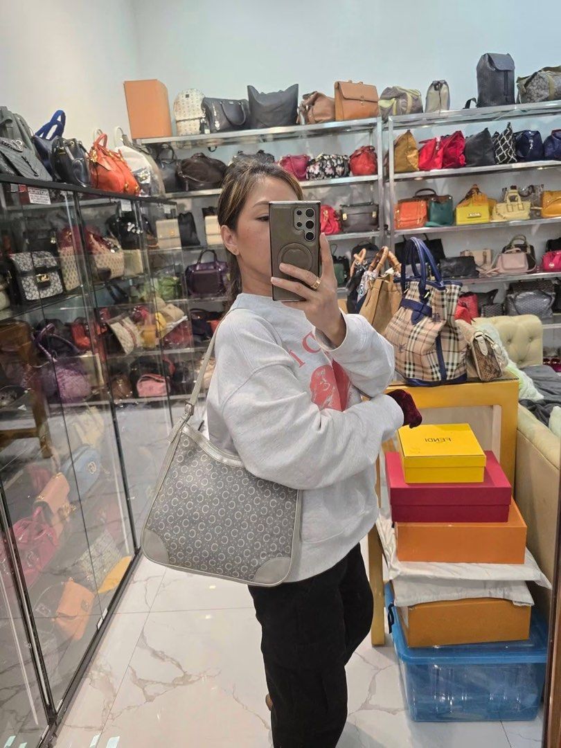 Celine Macadam Canvas Shoulder Bag Gray Authentic💯 (Category: Luxury Bags & Wallets) located in Davao. Submitted by signatureshoesandbags (Listing ID 1456702880, Image 3). Description: - Vintage Celine shoulder bag - Medium size - With generic dustbag - Iconic Macadam print - Gray color - Early 2000s release - Discontinued, no longer sold in stores - Classic and timeless design - Ideal for everyday use.