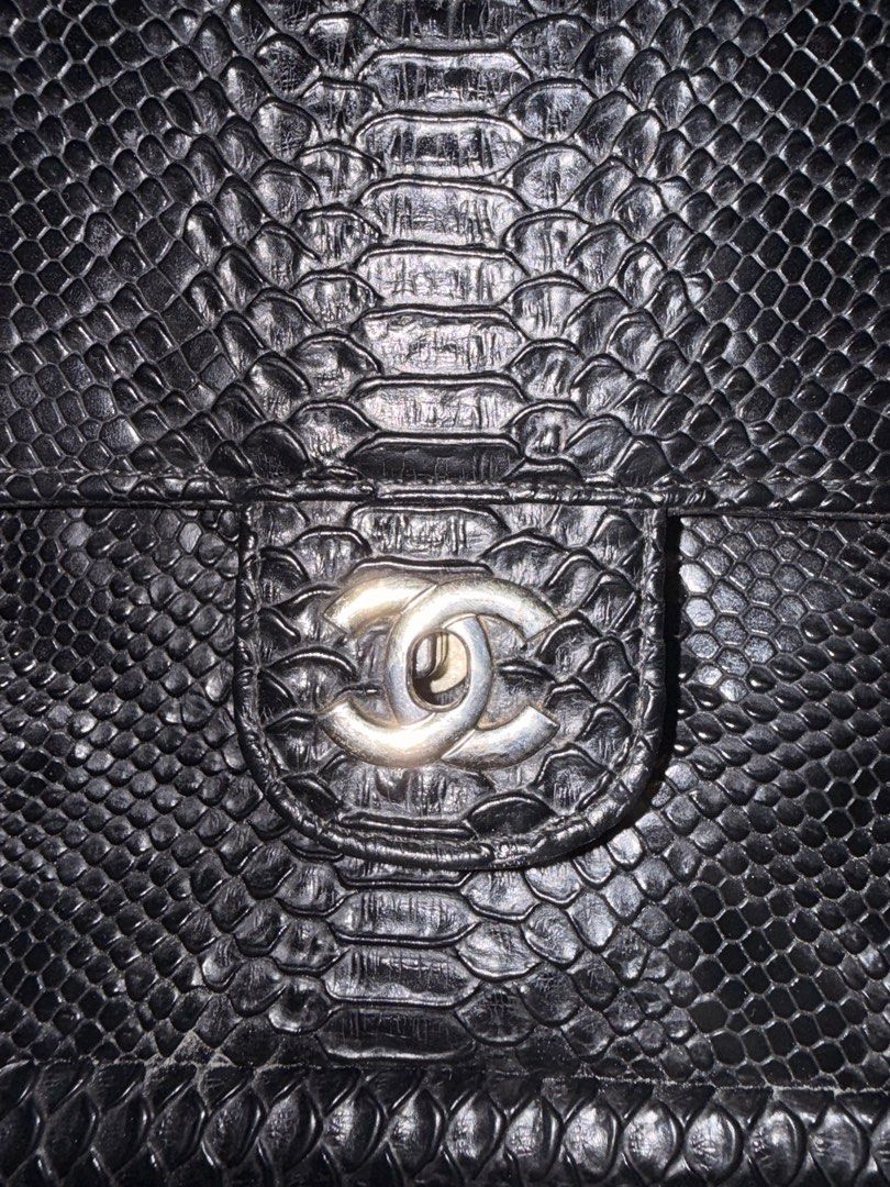 Chanel Black Python Flap Bag (Category: Luxury Bags & Wallets) located in Binalonan. Submitted by katkatt121 (Listing ID 1456611982, Image 3). Description: - Genuine black python skin flap bag - Elegant silver chain strap - Striking red interior lining - Iconic CC logo clasp - Medium size, perfect for essentials - Versatile wear: crossbody or shoulder - A stunning statement piece to elevate any outfit RUSH! NEGOTIABLE ACTUAL PHOTO IS POSTED.