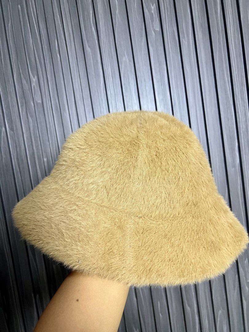 Chanel Bucket Hat - Fuzzy Tan (Category: Hats & Beanies) located in Baguio. Submitted by chiechie1234 (Listing ID 1456690071, Image 3). Description: - Super cute fuzzy bucket hat - Tan color - Iconic Chanel logo embroidered on front - Soft and comfortable material - Perfect for sun protection or a stylish look - Versatile accessory for any outfit.