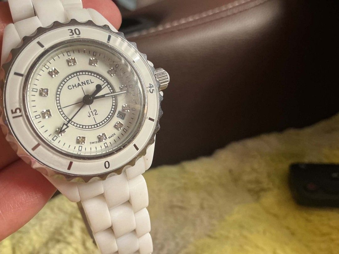 Chanel J12 White Ceramic Diamond Dial Watch (Category: Luxury Watches) located in Malabon City. Submitted by raizavitan1234 (Listing ID 1456640206, Image 1). Description: - Authentic Chanel J12 Watch - Color: White - Material: Ceramic - Movement: Swiss Quartz - Features: Diamond markers on dial - Water Resistance: 200m - Model Number: SF 2001 - Condition: Good overall, with minor signs of wear on bezel and clasp..