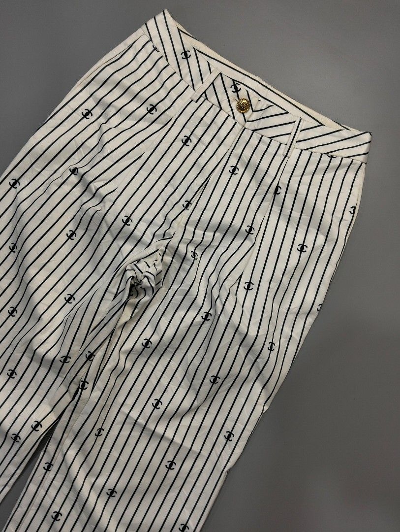 Chanel stripe multiple cc logo baggy pants (Category: Luxury Apparel) located in Bulacan. Submitted by recycloth_ (Listing ID 1456605796, Image 3). Description: Chanel stripe multiple cc logo baggy pants size on tag 38 actual waistline : 26-27 Length : 37" Leg opening : 9.5" in great condition no issue or flaws hmu!.