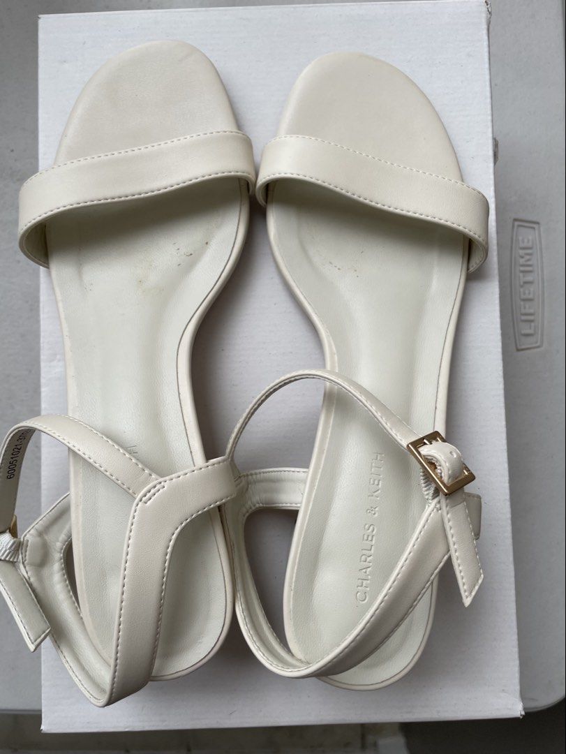 Charles & Keith White Heels / Sandals Size 37 (Category: Heels) located in Manila. Submitted by lvdybugs (Listing ID 1456630384, Image 2). Description: - Brand: Charles & Keith - Color: White - Style: Open-toe heels with back strap - Size: 37 - Condition: Selling as is.