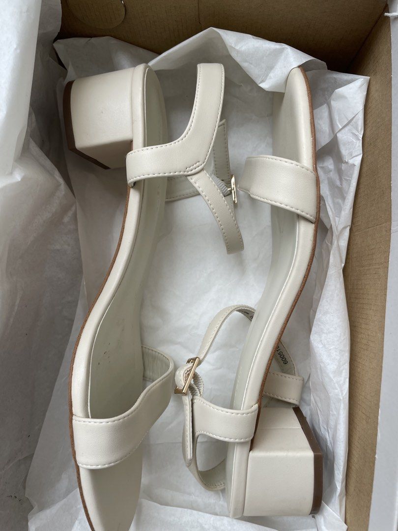 Charles & Keith White Heels / Sandals Size 37 (Category: Heels) located in Manila. Submitted by lvdybugs (Listing ID 1456630384, Image 1). Description: - Brand: Charles & Keith - Color: White - Style: Open-toe heels with back strap - Size: 37 - Condition: Selling as is.