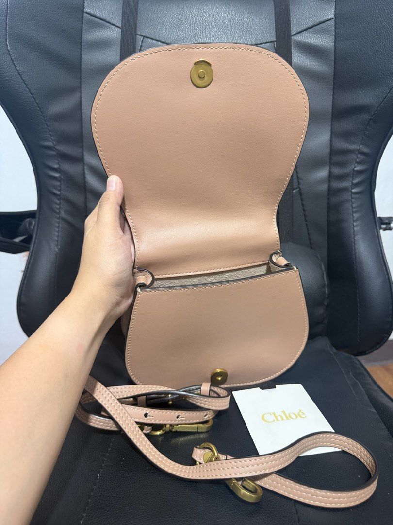Chloe Nile - Nude Pink (Category: Luxury Bags & Wallets) located in Antipolo. Submitted by declutteringirlie0317 (Listing ID 1456720147, Image 2). Description: - Beautiful nude pink color - Smooth, high-quality leather - Unique gold ring handle - Detachable strap for crossbody wear - Interior slip pocket - Comes with Chloe dust bag and authenticity card - Versatile for daily use or special events.