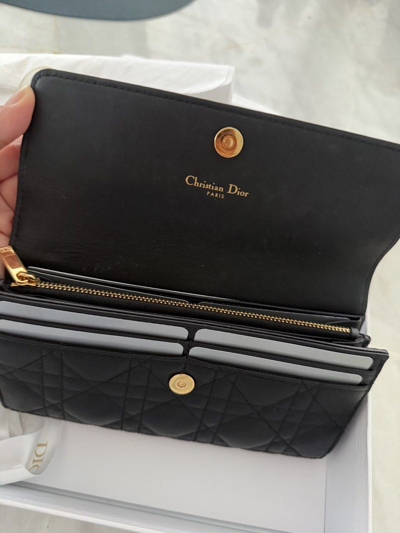 Authentic Christian Dior Black Leather Caro Wallet (Category: Luxury Bags & Wallets) located in Taguig. Submitted by claire08hyun (Listing ID 1456719150, Image 2). Description: - Authentic Christian Dior black leather wallet - Features iconic cannage stitching - Gold-tone CD hardware on the front - Interior: Card slots and a zip compartment - Comes with original dust bag and box -Calfskin leather -with store receipt -rfs: kept unused.