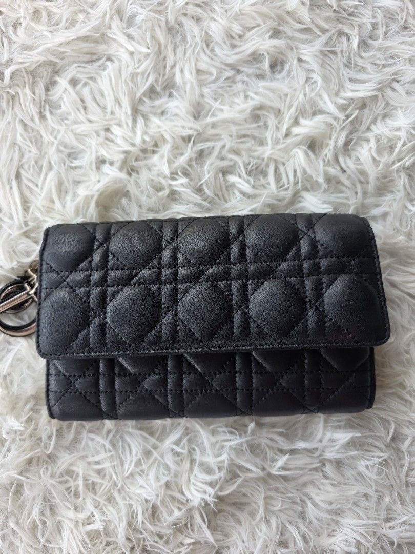 Black Quilted Leather Wallet (Category: Purses & Pouches) located in Lemery. Submitted by venus23 (Listing ID 1456617706, Image 1). Description: - Made in Italy - Classic Cannage Quilting - Snap Button Closure - Zippered Coin Pocket - Plenty of Card Slots & Compartments - Dimensions: Approx. 7.5" L x 4" H - Ideal for organizing essentials.