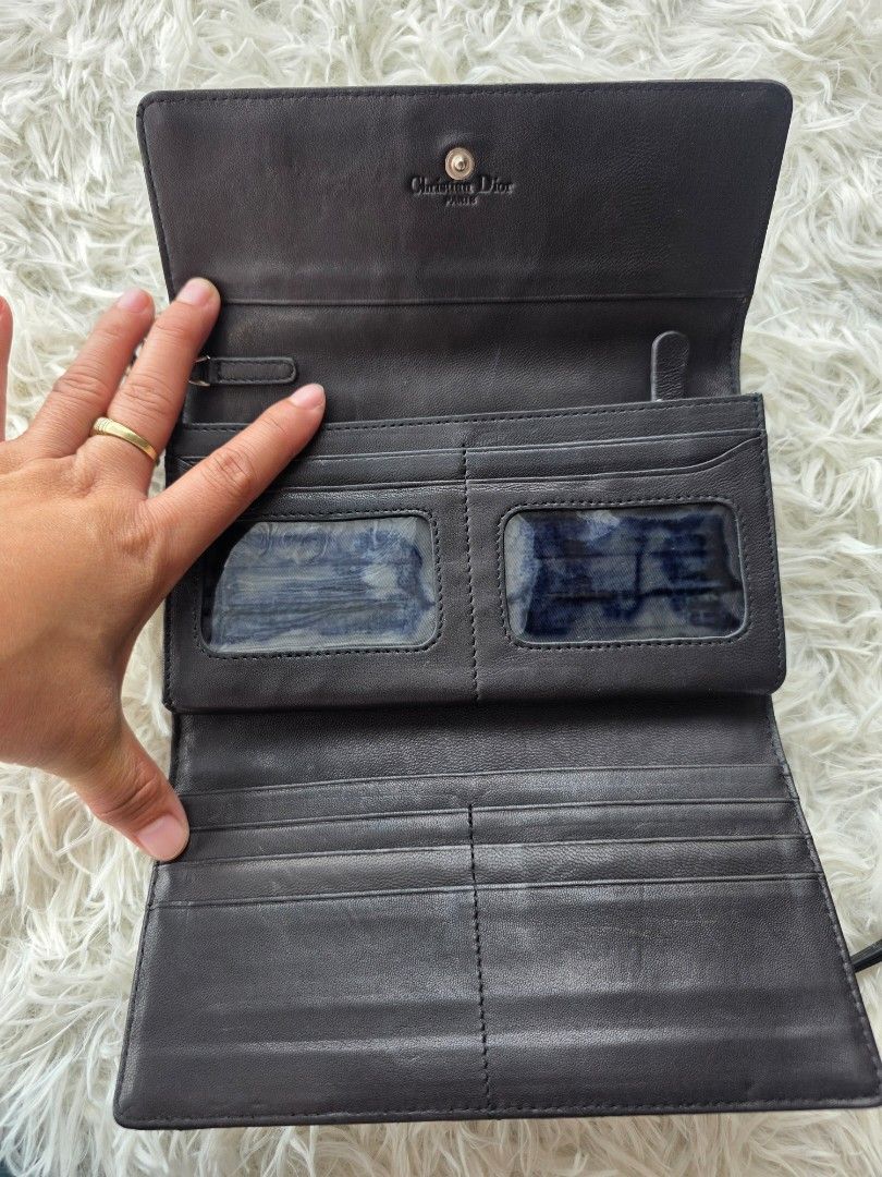 Black Quilted Leather Wallet (Category: Purses & Pouches) located in Lemery. Submitted by venus23 (Listing ID 1456617706, Image 3). Description: - Made in Italy - Classic Cannage Quilting - Snap Button Closure - Zippered Coin Pocket - Plenty of Card Slots & Compartments - Dimensions: Approx. 7.5" L x 4" H - Ideal for organizing essentials.
