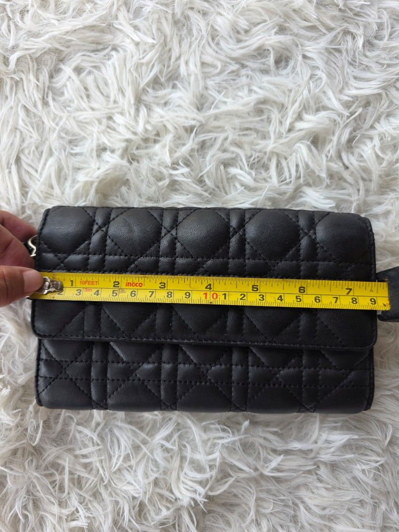 Black Quilted Leather Wallet (Category: Purses & Pouches) located in Lemery. Submitted by venus23 (Listing ID 1456617706, Image 2). Description: - Made in Italy - Classic Cannage Quilting - Snap Button Closure - Zippered Coin Pocket - Plenty of Card Slots & Compartments - Dimensions: Approx. 7.5" L x 4" H - Ideal for organizing essentials.