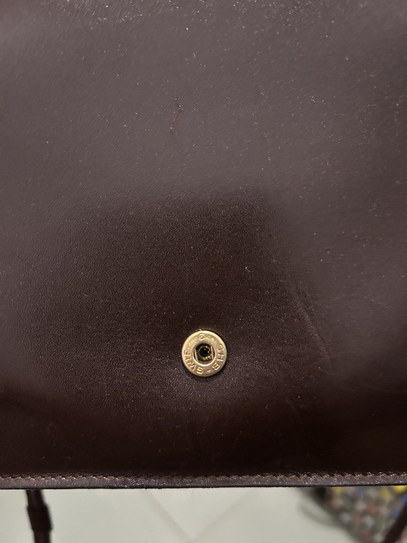 Christian Dior Brown Leather Envelope Shoulder Bag (Category: Luxury Bags & Wallets) located in Angeles City. Submitted by cassey_phoenix (Listing ID 1456727446, Image 3). Description: - Authentic Vintage Christian Dior Shoulder Bag - Made in Spain - Classic Brown Leather - Signature Gold 'CD' Logo - Elegant Envelope Style Flap Closure - Secure Snap Button Fastening - Interior Zip Pocket for Essentials - Versatile for Everyday or Special Occasion