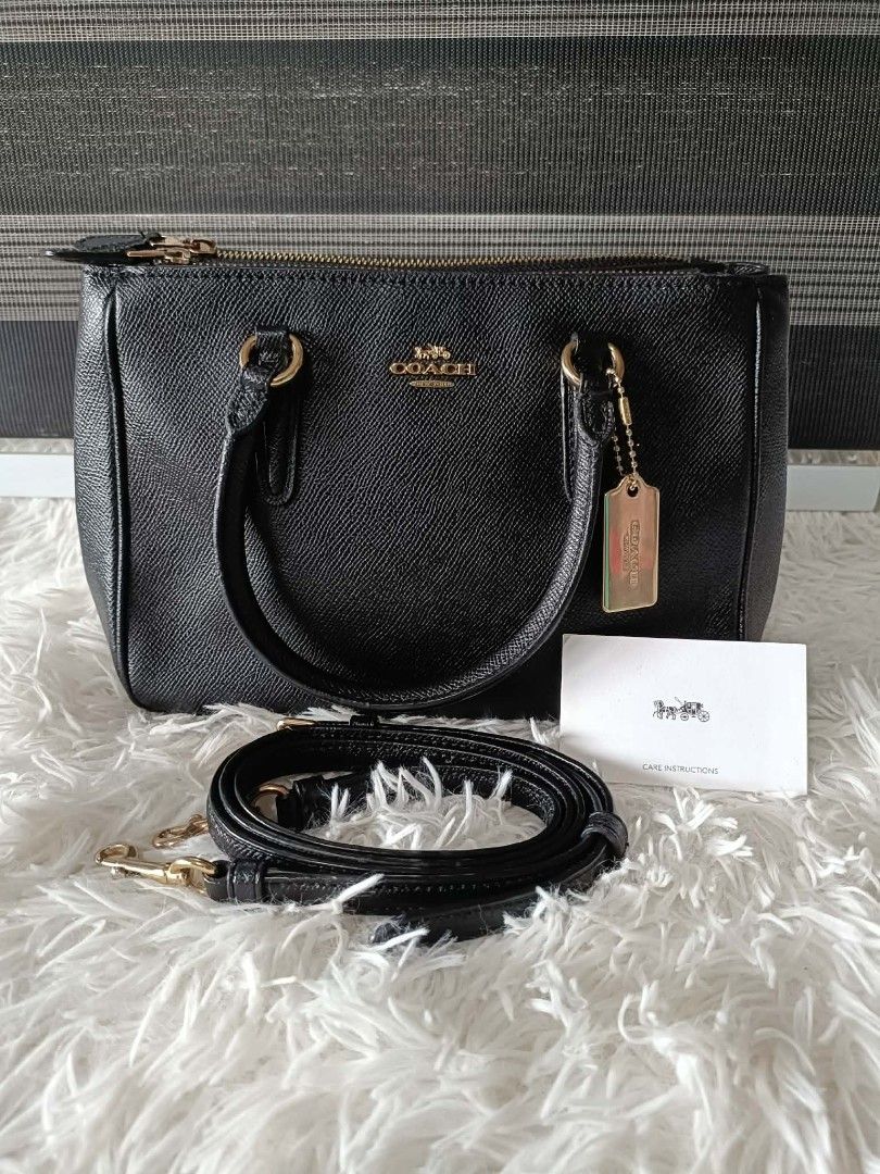 Coach Black Pebbled Leather Satchel Bag with Strap (Category: Luxury Bags & Wallets) located in Iba. Submitted by royalgemini (Listing ID 1456655582, Image 1). Description: - Authentic black Coach satchel bag - Made of premium pebbled leather - Elegant gold hardware details - Versatile with a detachable shoulder strap - Spacious interior with multiple compartments - Includes original care card and dust bag - Proudly made in the Philippines - Seri