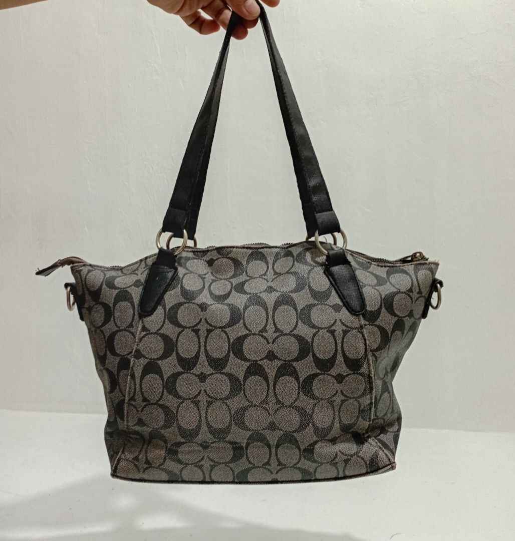 Coach Shoulder tote bag (Category: Luxury Bags & Wallets) located in Navotas City. Submitted by ms.soulana (Listing ID 1456622940, Image 2). Description: PreOwned Lightly Used WellUsed Coach monogram Shoulder tote bag Off Small - Signature grey and black C pattern - Two top handles - Zip closure - Spacious interior for essentials - Versatile for daily use Sign of Used flaws : hardwares fade,rubs ,min tarnish , only needs Polish ) ,, Good Working 