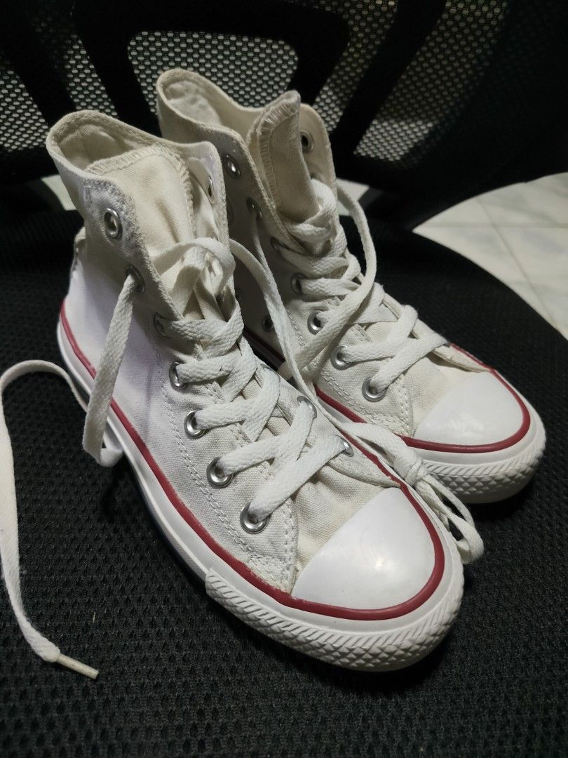 Converse All Star High Top Canvas Shoes White (Category: Sneakers) located in Malaybalay. Submitted by thrifturessential (Listing ID 1456759733, Image 2). Description: - Classic white Converse high tops - Durable canvas material - Iconic red and blue stripe detail on the sole - Secure lace-up closure - Versatile for everyday wear, pairs with any outfit.