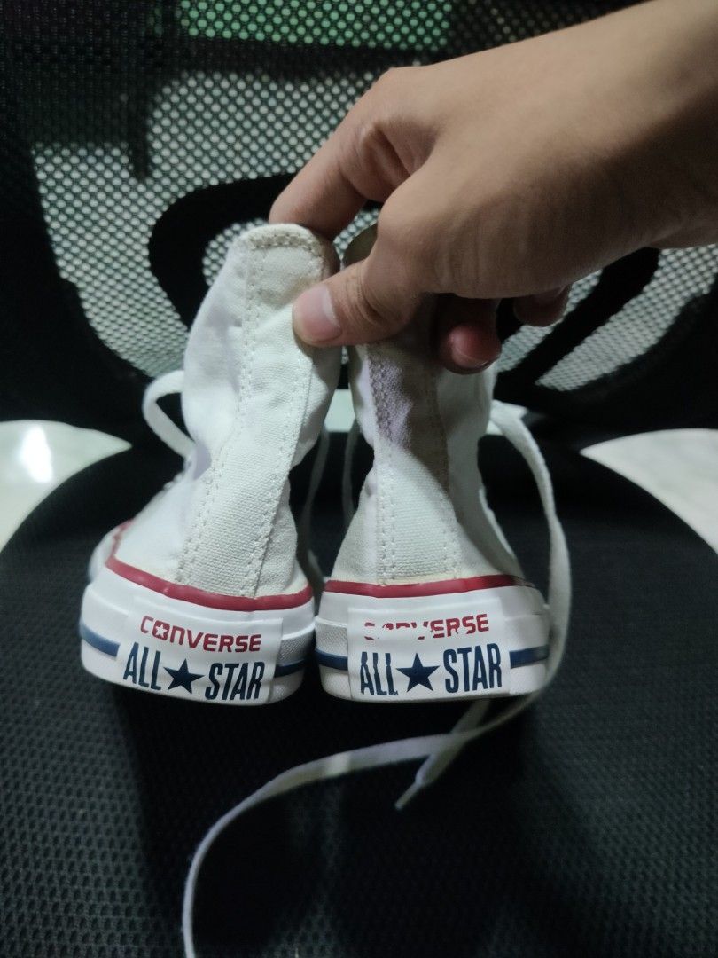 Converse All Star High Top Canvas Shoes White (Category: Sneakers) located in Malaybalay. Submitted by thrifturessential (Listing ID 1456759733, Image 3). Description: - Classic white Converse high tops - Durable canvas material - Iconic red and blue stripe detail on the sole - Secure lace-up closure - Versatile for everyday wear, pairs with any outfit.