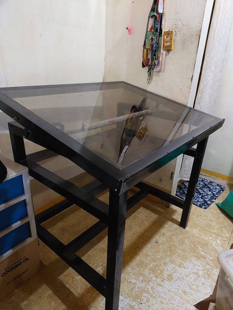 Customized Glass Drafting Table (Category: Tables & Sets) located in Dasmarinas. Submitted by unclaire (Listing ID 1382975251, Image 2). Description: Customized Glass Drafting Table - Dimension: W 1m x D 0.81m x H 0.84m - has LED light good for tracing (LED light is new) - has t-square stopper - has storage for cannisters and drafting materials - has one inclination angle only - used this for 2 years only Issue: - may crack sa glass ng storage pw