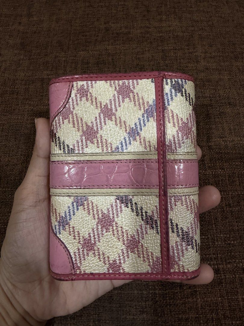 Daks Wallet (Category: Luxury Bags & Wallets) located in Manila. Submitted by coffeepanda1234 (Listing ID 1456677878, Image 2). Description: Shows a pink and cream plaid pattern trifold wallet from the British luxury brand DAKS, featuring a center croc-embossed pink leather strip and a metallic logo clasp..