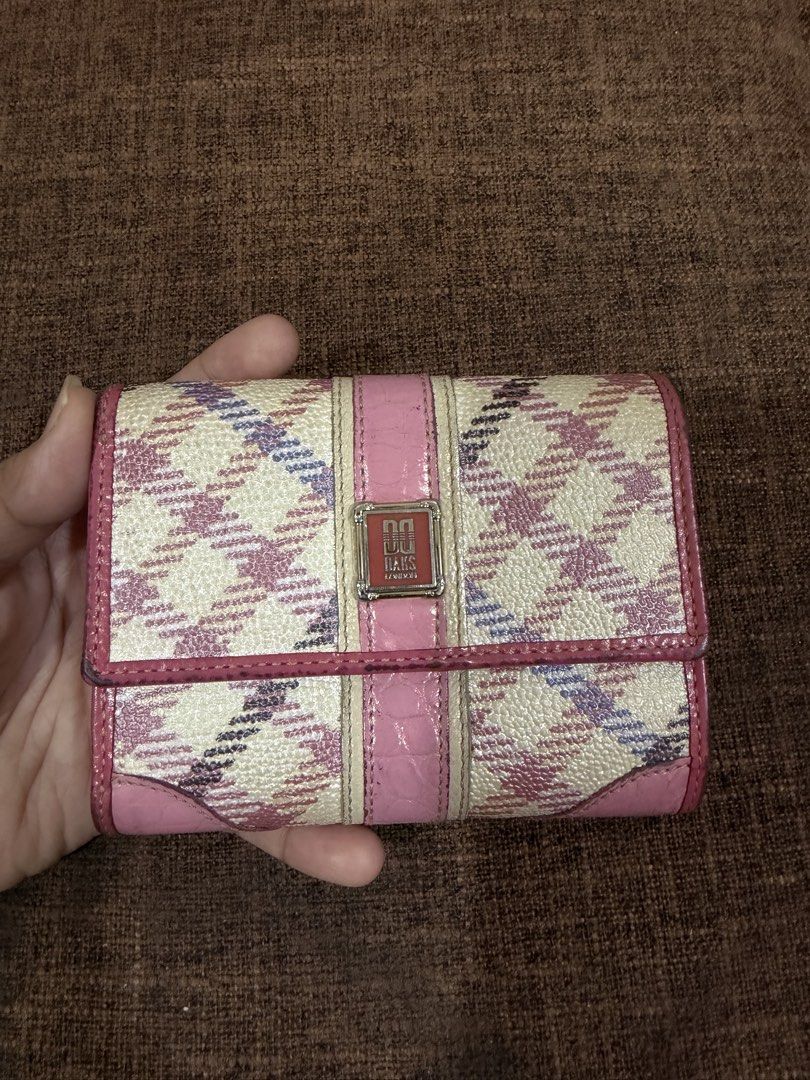Daks Wallet (Category: Luxury Bags & Wallets) located in Manila. Submitted by coffeepanda1234 (Listing ID 1456677878, Image 1). Description: Shows a pink and cream plaid pattern trifold wallet from the British luxury brand DAKS, featuring a center croc-embossed pink leather strip and a metallic logo clasp..