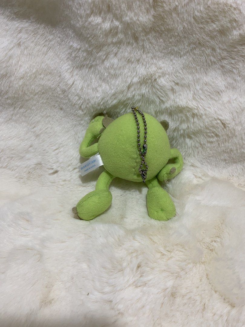 Disney Pixar Mike Wazowski Plush Charm Keychain (Category: Plushies & Soft Toys) located in Kalibo. Submitted by ollie_stuffshop (Listing ID 1456631205, Image 2). Description: Before you send your inquiries: ❗️Last Price is already posted ❗️Manage your expectations, WYSIWYG ❗️May need washing ❗️Shipping day is every Sunday - Cute Mike Wazowski plush keychain - Authentic from Tokyo Disney Resort - Features his signature one eye and grin - Includes