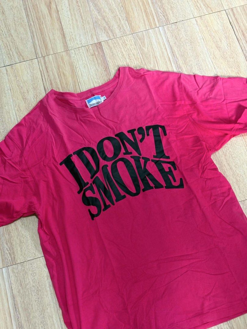 Don'smake Pink Graphic T-shirt (Category: Tshirts & Polo Shirts ) located in Pasig City. Submitted by thriftzzsweep (Listing ID 1456719281, Image 1). Description: - Pink graphic tee from Don'smake - Features bold black text: 'I DON'T SMOKE' - Comfortable and casual design - Perfect for everyday wear.