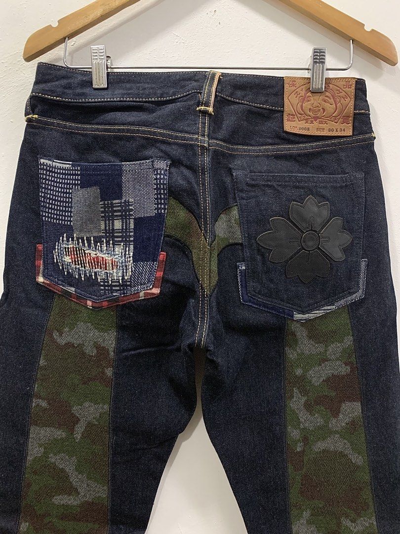 EVISU LOT 2008 DAICOCK - PATCHWORK SELVEDGE DENIM JEANS (Category: Jeans) located in Cavite. Submitted by ___layern0ne (Listing ID 1456704437, Image 2). Description: About the product: • Unique patchwork and camouflage daicock detailing on the back • Classic Evisu branding on leather patch Tagged Size: 30 x 34 Waistline: 31 Front Rise: 10 inches Leg Opening: 7.7 inches Length: 43 inches Measured laid flat and at its longest point Slightly wrinkle
