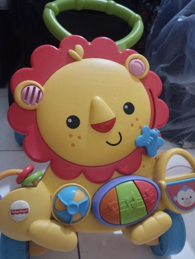 Fisher-Price Lion Walker Toy (Category: Infant Playtime) located in Manila. Submitted by ljaneee (Listing ID 1456625331, Image 1). Description: - Fisher-Price Lion Walker - Lots of interactive buttons and sounds - Helps baby learn to walk - Great for developing motor skills.