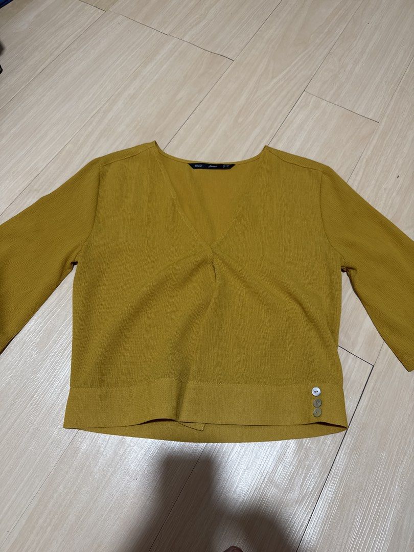 Forme Mustard Yellow V-Neck Top with Button Detail (Category: Blouses) located in Manila. Submitted by sumisloveditems (Listing ID 1456772563, Image 2). Description: Mustard yellow V-neck top size: XXS can fit upto S P300 Mode of payment: Gcash Gotyme Mode of delivery: J&T SDD.