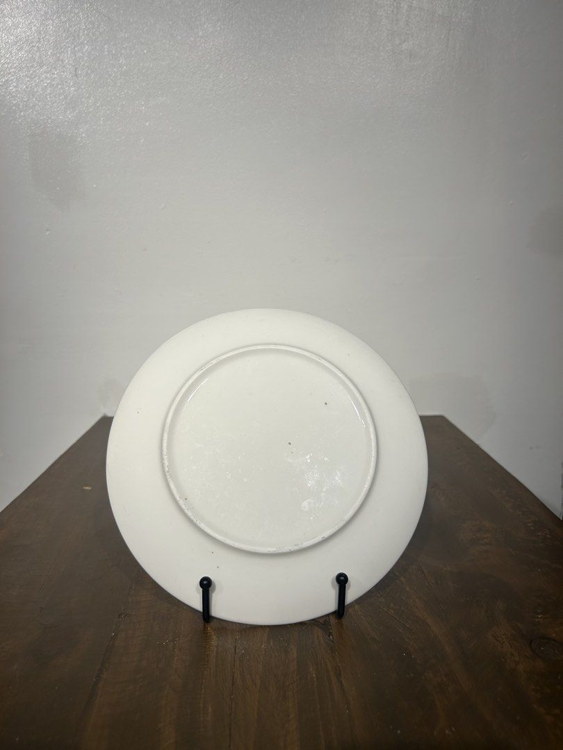 Fornasetti Inspired 10” plates with plate stand (Category: Other Home Decor) located in Pasay City. Submitted by kevgoodflower (Listing ID 1456776333, Image 3). Description: Inspired not authentic Sold as set if 2 w/Free plate stands 10” diameter Wink Tongue out (w/chipping).
