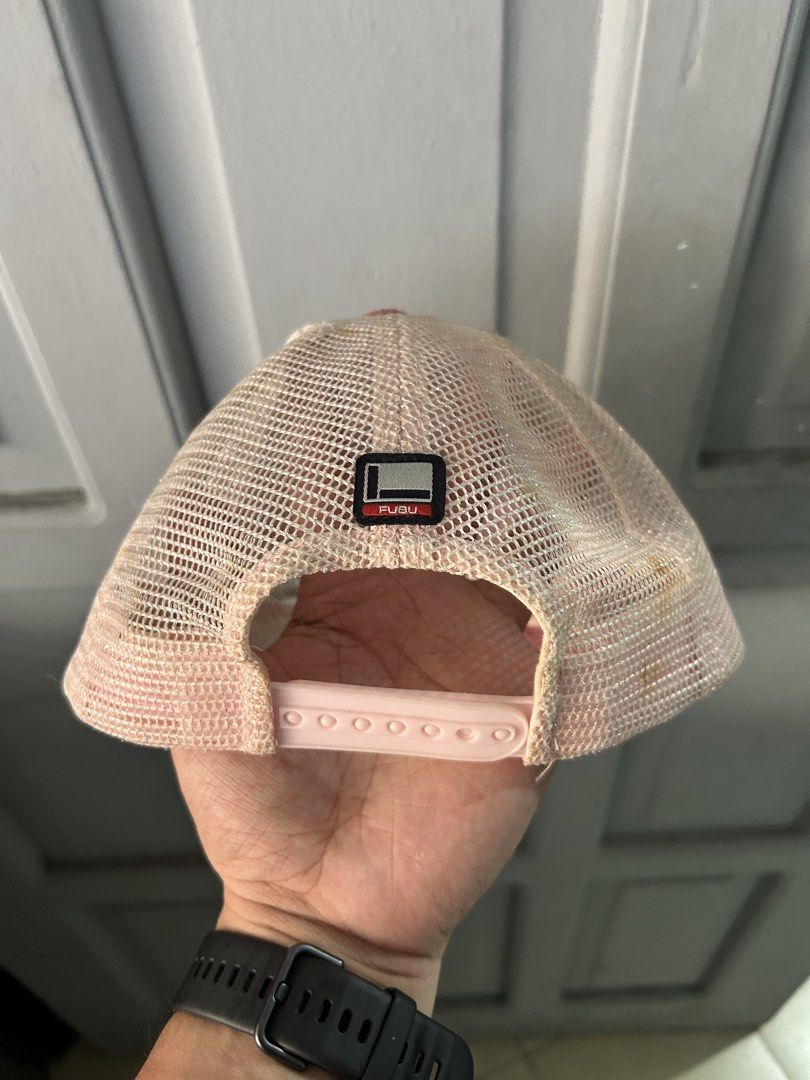 FUBU The Original Pink Glitter Trucker Hat with Chains (Category: Caps & Hats) located in Davao. Submitted by orbetaarch23339 (Listing ID 1456772892, Image 2). Description: - Pink FUBU trucker hat - Glittery material with chain details and coin charms - Mesh back for breathability - Adjustable snapback closure for a custom fit - FUBU The Original collection - Size XX.