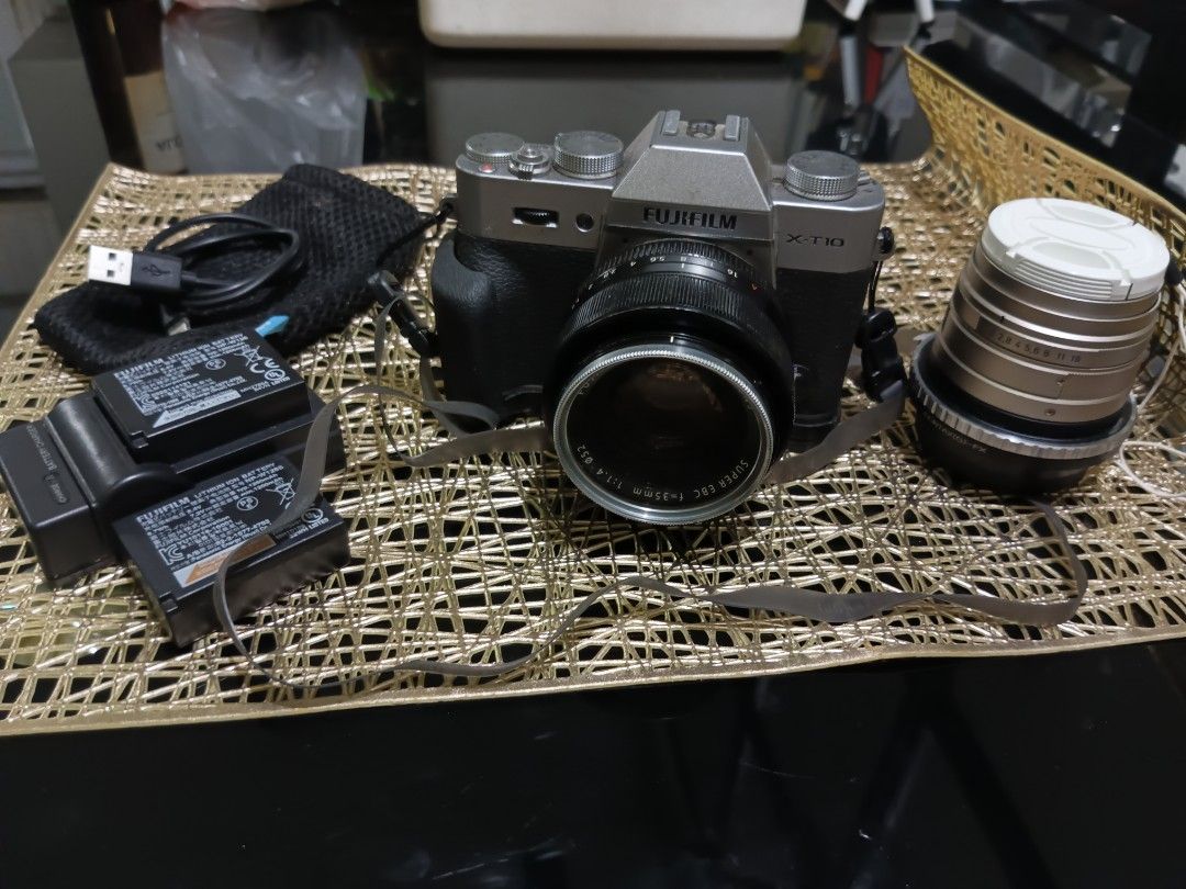 Fujifilm X-T10 Set (Category: Cameras) located in Quezon City. Submitted by markgolveo (Listing ID 1456609657, Image 1). Description: Fujifilm X-T10 Body signs of wear on cosmetics Issue on viewfinder scope not working Led display screen working properly but has edge slight blackening Good all buttons functioning properly - rubber water proof slim extendable strap - fujinon aspherical lens super ebc f 35mm 1 1.4 with nikor L39 52mm lens filter -w
