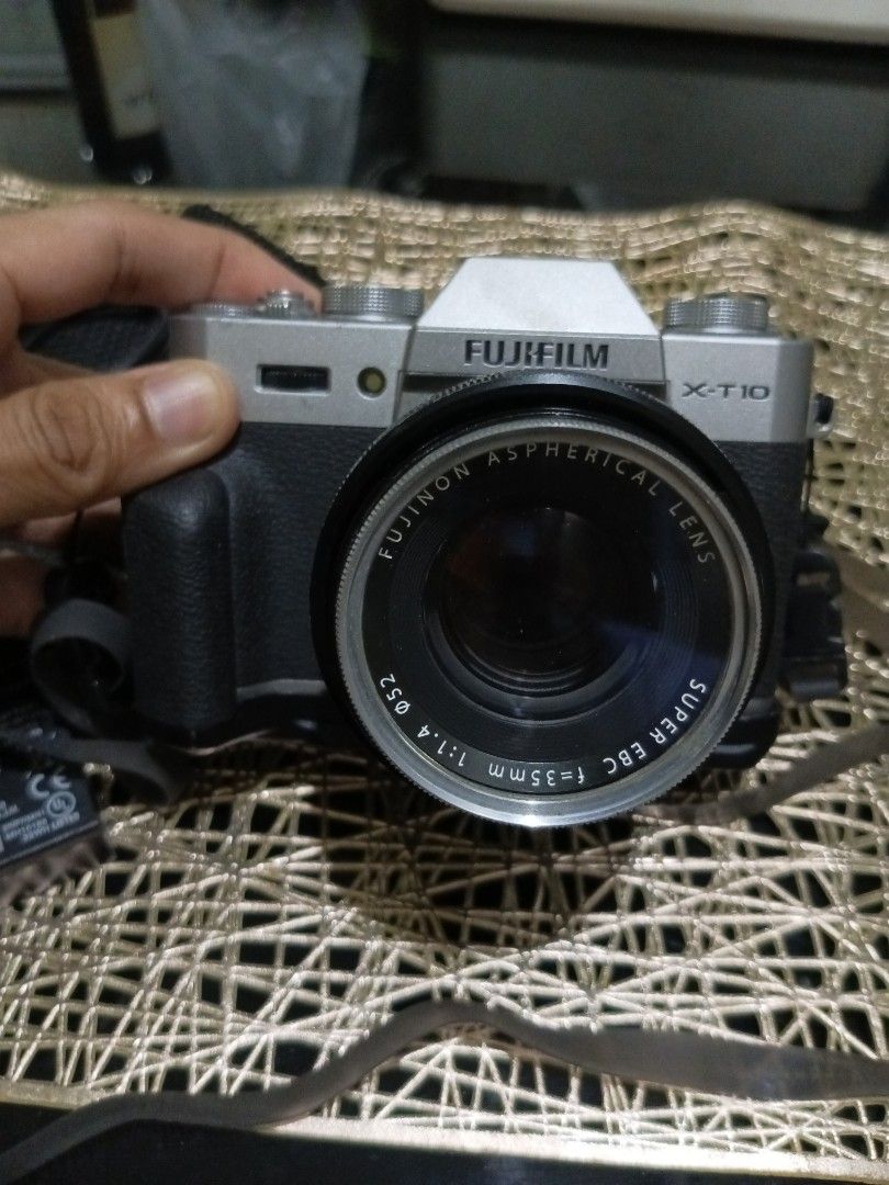 Fujifilm X-T10 Set (Category: Cameras) located in Quezon City. Submitted by markgolveo (Listing ID 1456609657, Image 2). Description: Fujifilm X-T10 Body signs of wear on cosmetics Issue on viewfinder scope not working Led display screen working properly but has edge slight blackening Good all buttons functioning properly - rubber water proof slim extendable strap - fujinon aspherical lens super ebc f 35mm 1 1.4 with nikor L39 52mm lens filter -w