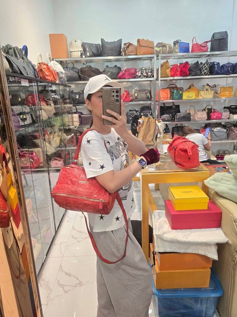 Givenchy Red Leather Nightingale Authentic💯 (Category: Luxury Bags & Wallets) located in Davao. Submitted by signatureshoesandbags (Listing ID 1456707673, Image 2). Description: - Genuine red leather Givenchy Nightingale bag - With generic dustbag - Distinctive crinkled leather texture - Versatile carrying options: top handles and detachable shoulder strap - Convenient front zippered pockets - Elegant gold hardware details - A chic and classic d