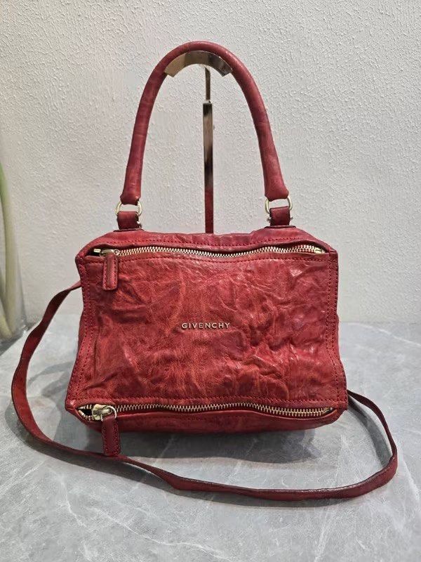 Givenchy Red Leather Nightingale Authentic💯 (Category: Luxury Bags & Wallets) located in Davao. Submitted by signatureshoesandbags (Listing ID 1456707673, Image 3). Description: - Genuine red leather Givenchy Nightingale bag - With generic dustbag - Distinctive crinkled leather texture - Versatile carrying options: top handles and detachable shoulder strap - Convenient front zippered pockets - Elegant gold hardware details - A chic and classic d