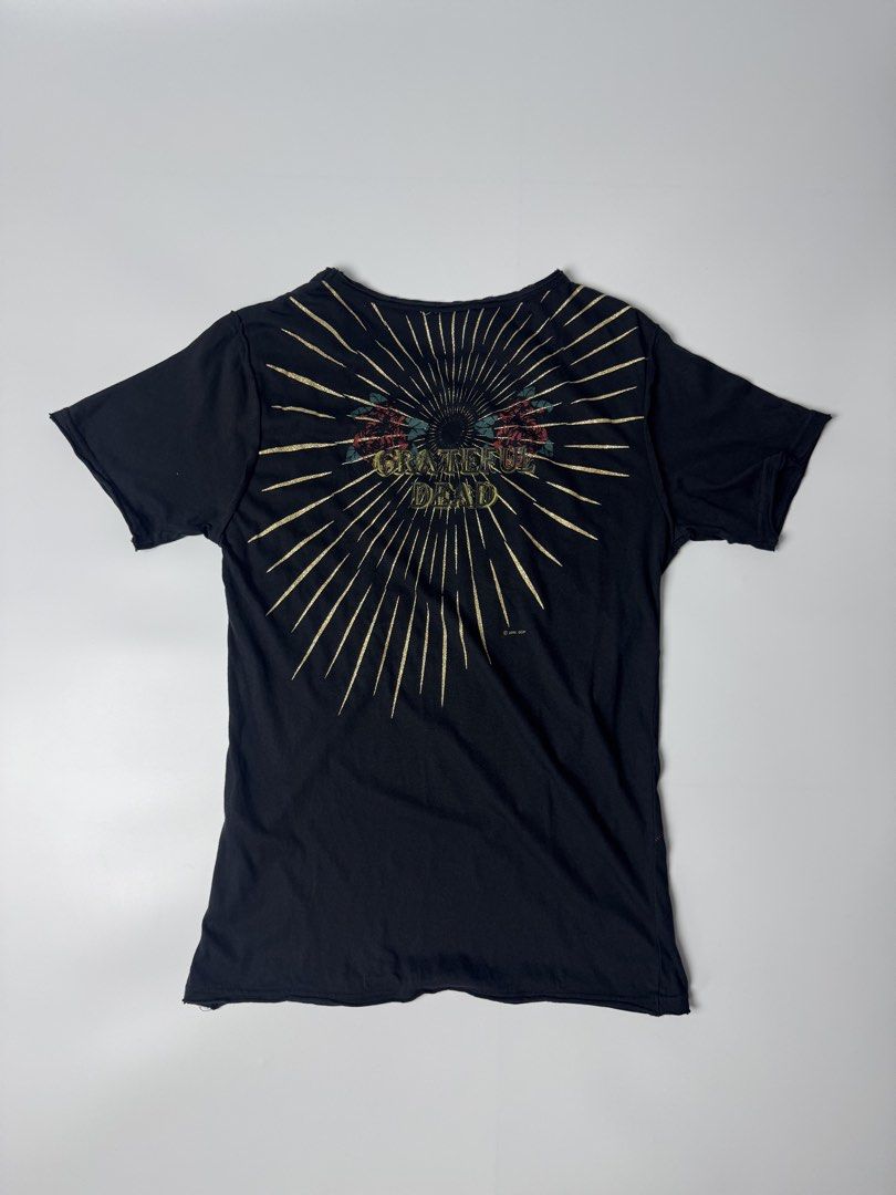 Grateful Dead 2006 GDP T-Shirt (Category: Tshirts & Polo Shirts ) located in Cavite. Submitted by dracokidstuff (Listing ID 1456729854, Image 2). Description: - Black Grateful Dead T-Shirt - Iconic Stealie Skull Graphic on Front - Sunburst Design with Roses on Back - Made in 2006 by GDP - Features some stitching details on the front - Ideal for any Grateful Dead fan (Deadhead).